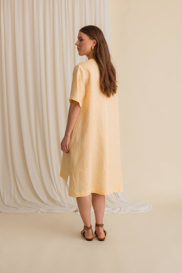 sheena dress apricot behind