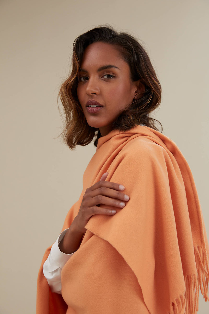 CLARISSA Fringed Wool Cashmere Poncho peach close up